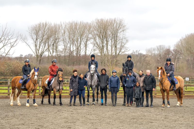 Lydia coaching a large group of riders